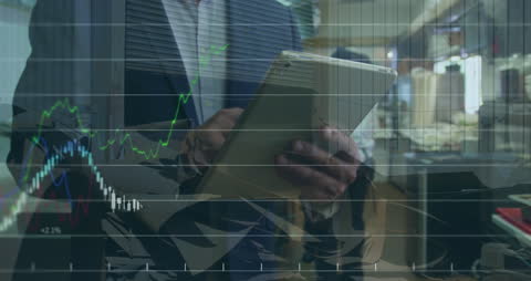 Businessman Analyzing Financial Stock Market Data on Tablet