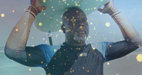 Mature Surfer Holding Surfboard on Sunny Beach