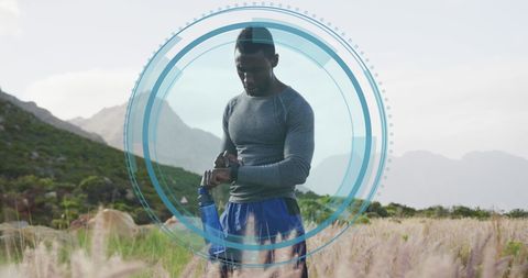 Athlete monitoring fitness with digital interface outdoors