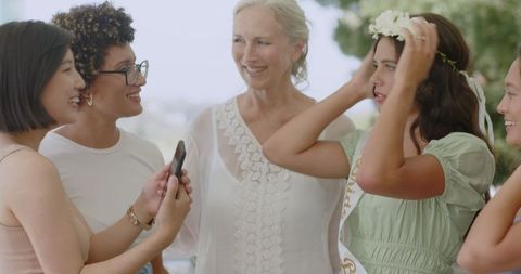 Diverse Women Celebrating Outdoor Gathering with Joyful Embrace
