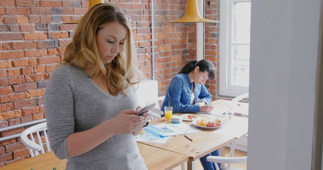 Businesswomen Working in Modern Office with Exposed Brick Walls - Download Free Stock Images Pikwizard.com