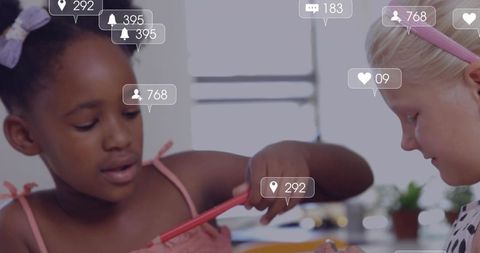 Two girls collaborating on craft and learning with social media likes and follower icons