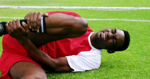 Injured Soccer Player Lying on Field with Leg Pain - Download Free Stock Images Pikwizard.com
