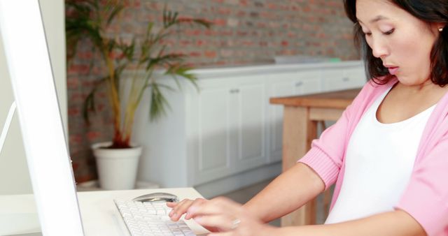 Surprised Woman Typing on Computer at Home Office Desk - Download Free Stock Images Pikwizard.com