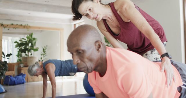 Personal Trainer Assisting Older Man in Yoga Class - Download Free Stock Images Pikwizard.com
