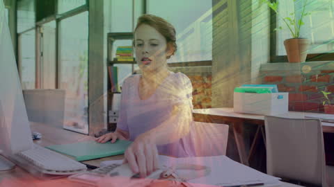 Businesswoman Using Computer with Futuristic Overlay in Office