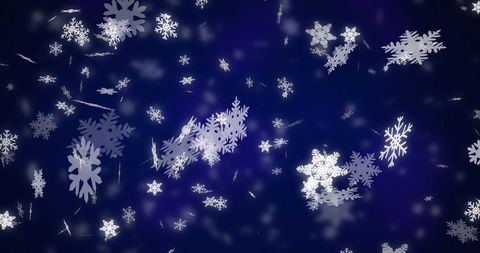 Snowflakes Falling Against Blue Winter Night Backdrop