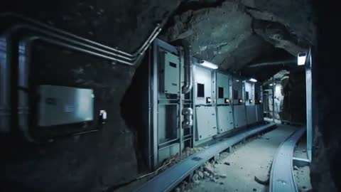 Traversing underground service tunnel surveying electrical panels, conduit and guide rail