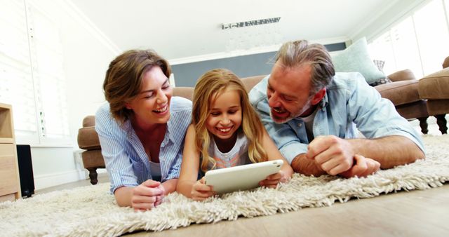 Happy Family Enjoying Quality Time with Digital Tablet at Home - Download Free Stock Images Pikwizard.com