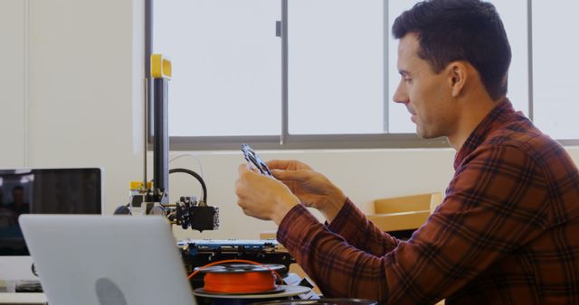 Man working with 3D printer in modern office - Download Free Stock Images Pikwizard.com