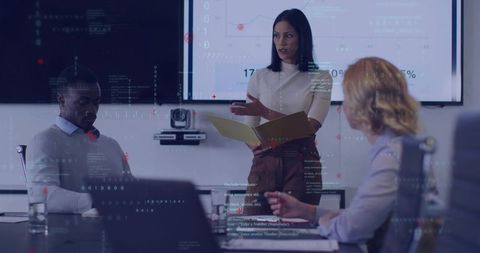 Businesswoman Presenting Data in Modern Office Environment