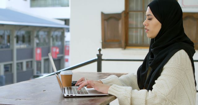 Focused Young Woman Working on Laptop in Cafe - Download Free Stock Images Pikwizard.com