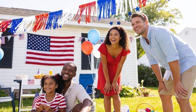 Backyard fourth of july family celebration with american flag, balloons and bunting