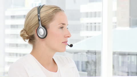 Dedicated Customer Service Agent Wearing Headset at Work