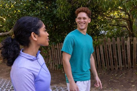 Friends Enjoying a Leisurely Nature Walk on a Woodland Trail