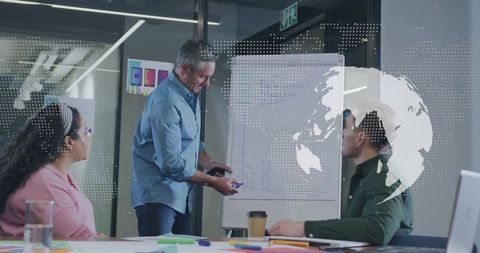 Professional presenting bar chart in collaborative office meeting