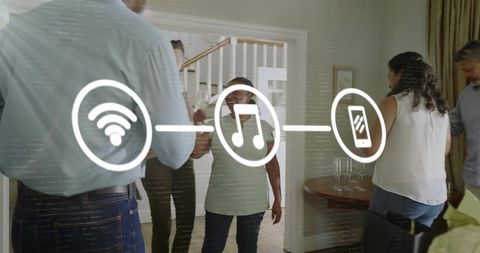 Friends clinking glasses while streaming wifi music in cozy home gathering