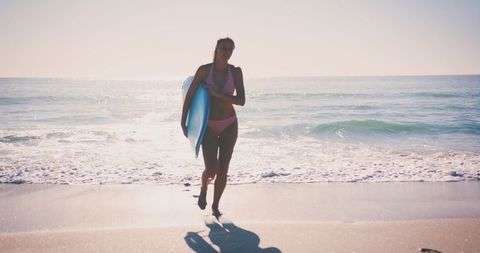 Young Woman with Surfboard on Sunny Beach Day - Download Free Stock Images Pikwizard.com