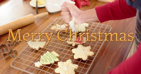 Festive Christmas Cookie Baking with Hand Icing - Download Free Stock Images Pikwizard.com