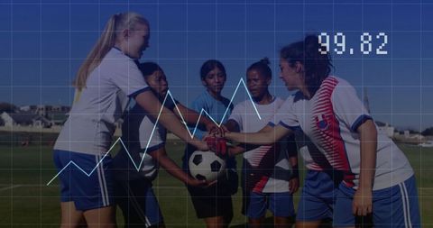 Female soccer team celebrating match victory and unity