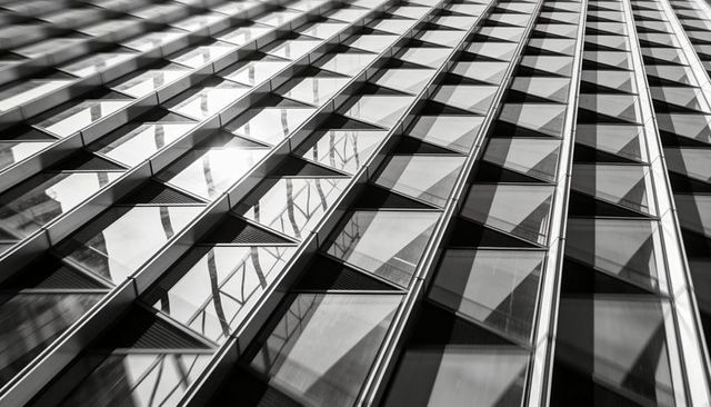 Low Oblique Urban Glass Facade Geometry with Diagonal Grid, Louvers and Reflective Panels