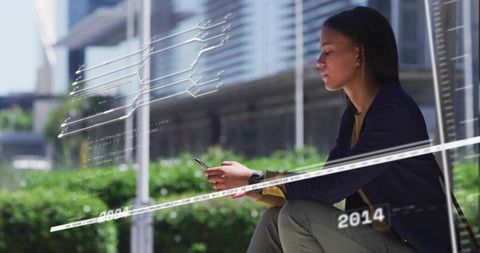 Businesswoman Using Smartphone with Floating Data Overlays in Urban Plaza