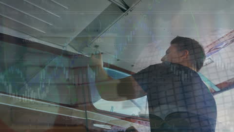 Engineer Working on Aircraft with Overlay of Financial Data and Globe