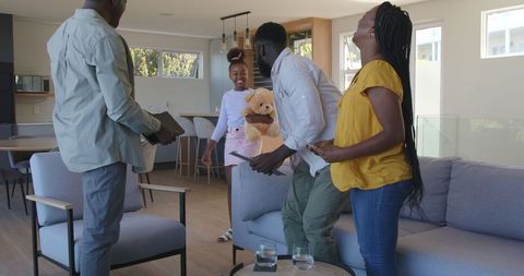 Family Embracing Together in Cozy Living Room Setting