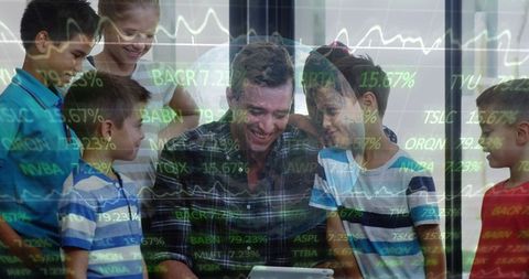 Mentor teaching children stock market on tablet