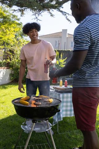 Diverse Friends Enjoying Backyard BBQ Gathering