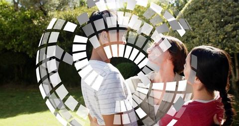 Family hugging in sunny yard with geometric mosaic overlay, warm outdoor togetherness