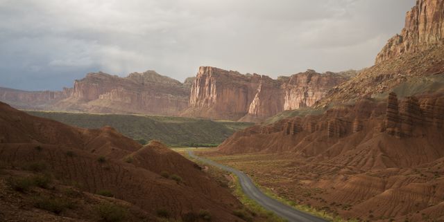 Scenic Desert Canyon Valley with Dramatic Cliff Formations - Download Free Stock Photos Pikwizard.com