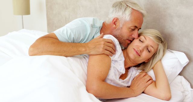 Senior Couple Embracing in Bed, Enjoying Peaceful Morning - Download Free Stock Images Pikwizard.com