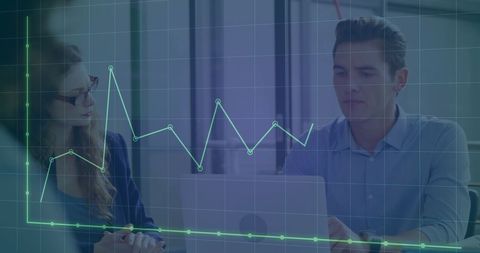 Business Professionals Analyzing Sales Data on Laptop Computers