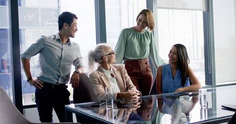 Diverse Business Team Collaborating at Modern Office Table - Download Free Stock Images Pikwizard.com