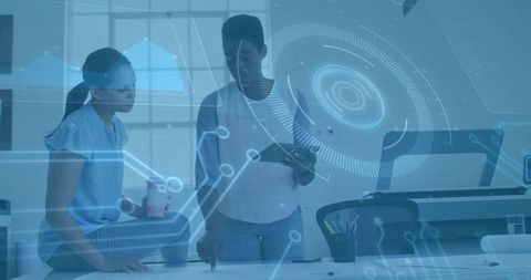 Women Collaborating on Project with Futuristic Digital Interface