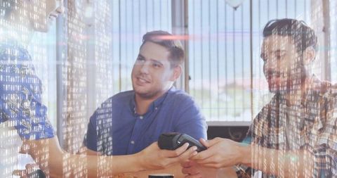 Young Professionals Making Contactless Payment in Modern Cafe