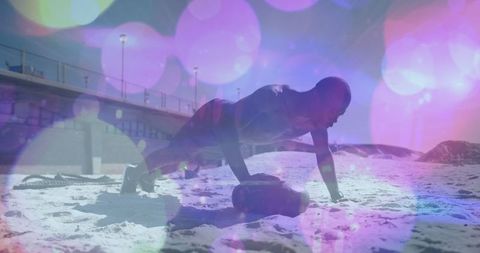 Motivated athlete doing beach workout in lively ambient atmosphere