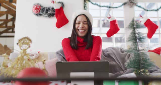 Biracial woman with santa hat having image call. Beauty, health and female spa home concept.