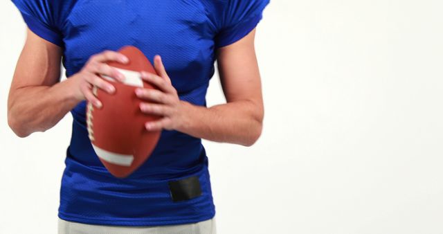 Football Player Holding Ball in Action Pose - Download Free Stock Images Pikwizard.com