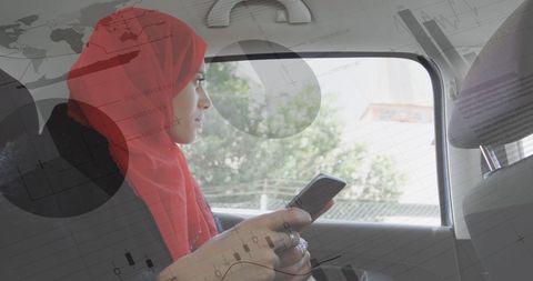 Arab Woman in Hijab Analyzing Data While Traveling in Car - Download Free Stock Images Pikwizard.com