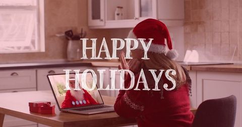 Virtual holiday greetings, woman in santa hat on video call