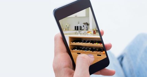 Smartphone Displaying Modern Kitchen Interior