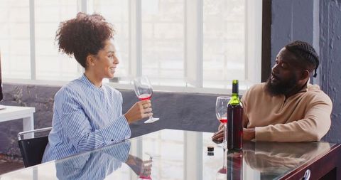 Relaxed Wine Moment Among Colleagues in Office Setting