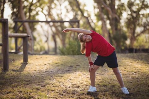 Child Enjoying Outdoor Exercise in Sunlit Park Setting