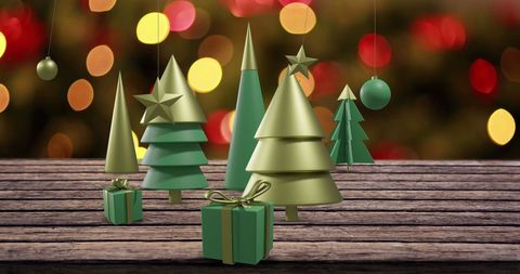 Festive Christmas Trees and Decorations on Wooden Surface - Download Free Stock Images Pikwizard.com