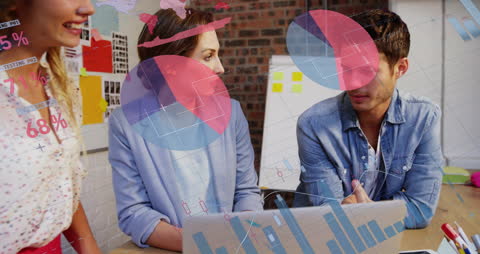 Creative Team Collaborating on Business Infographics in Modern Office