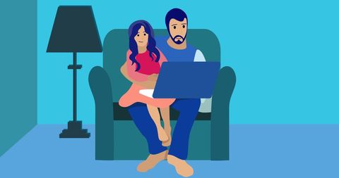Father and daughter bonding on couch with laptop