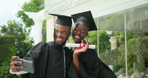 Joyous Students Celebrating Graduation in Caps and Gowns
