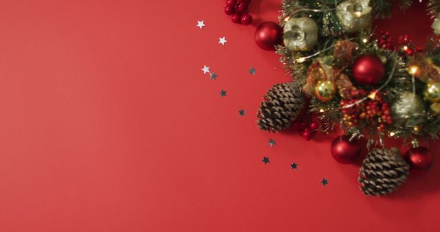 Christmas decorations with baubles and copy space on red background. christmas, tradition and celebration concept.